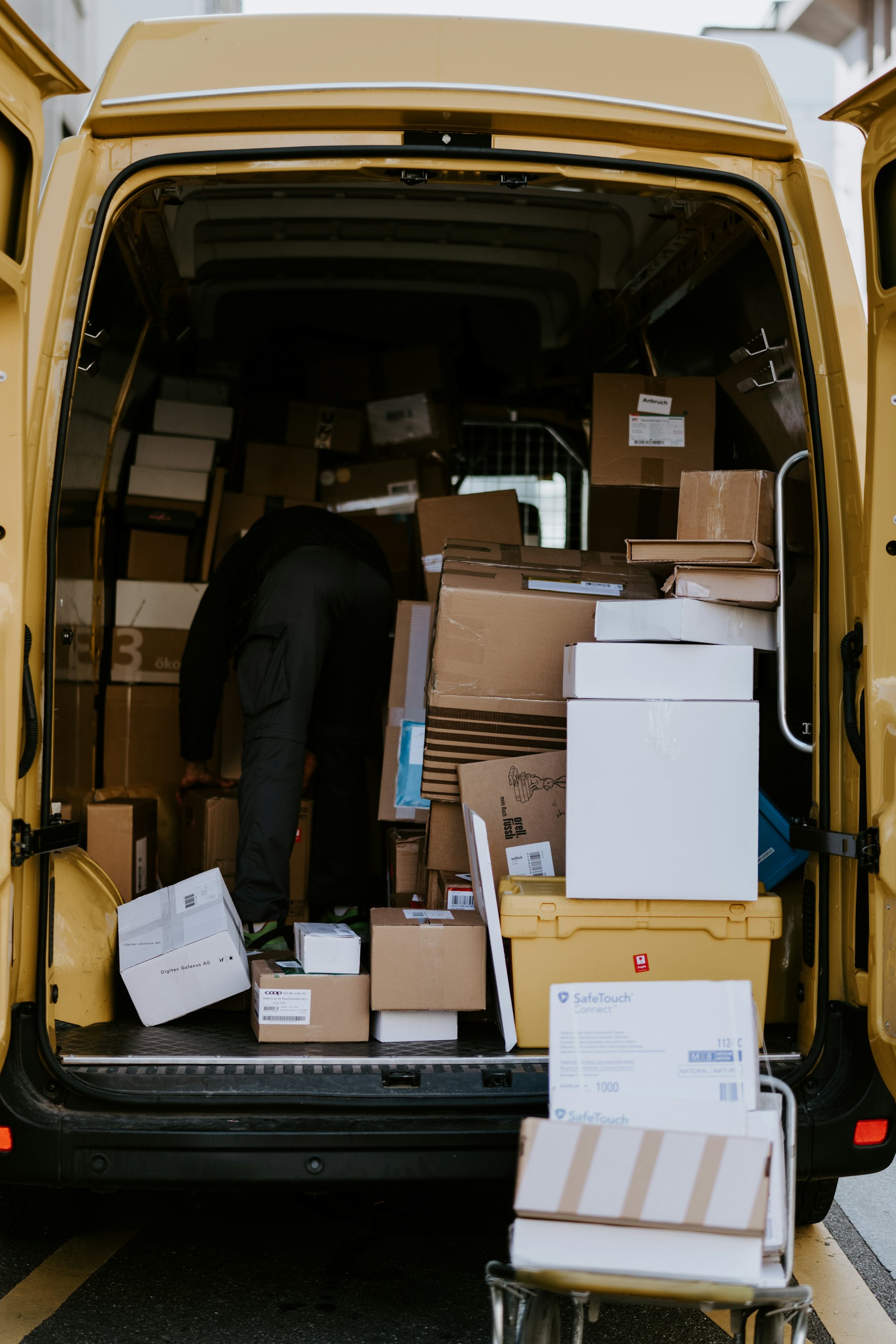 Stedfasts courier loading parcels into a delivery van in the Greater Toronto Area